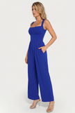 Model wearing jumpsuit, three-quarter angle
