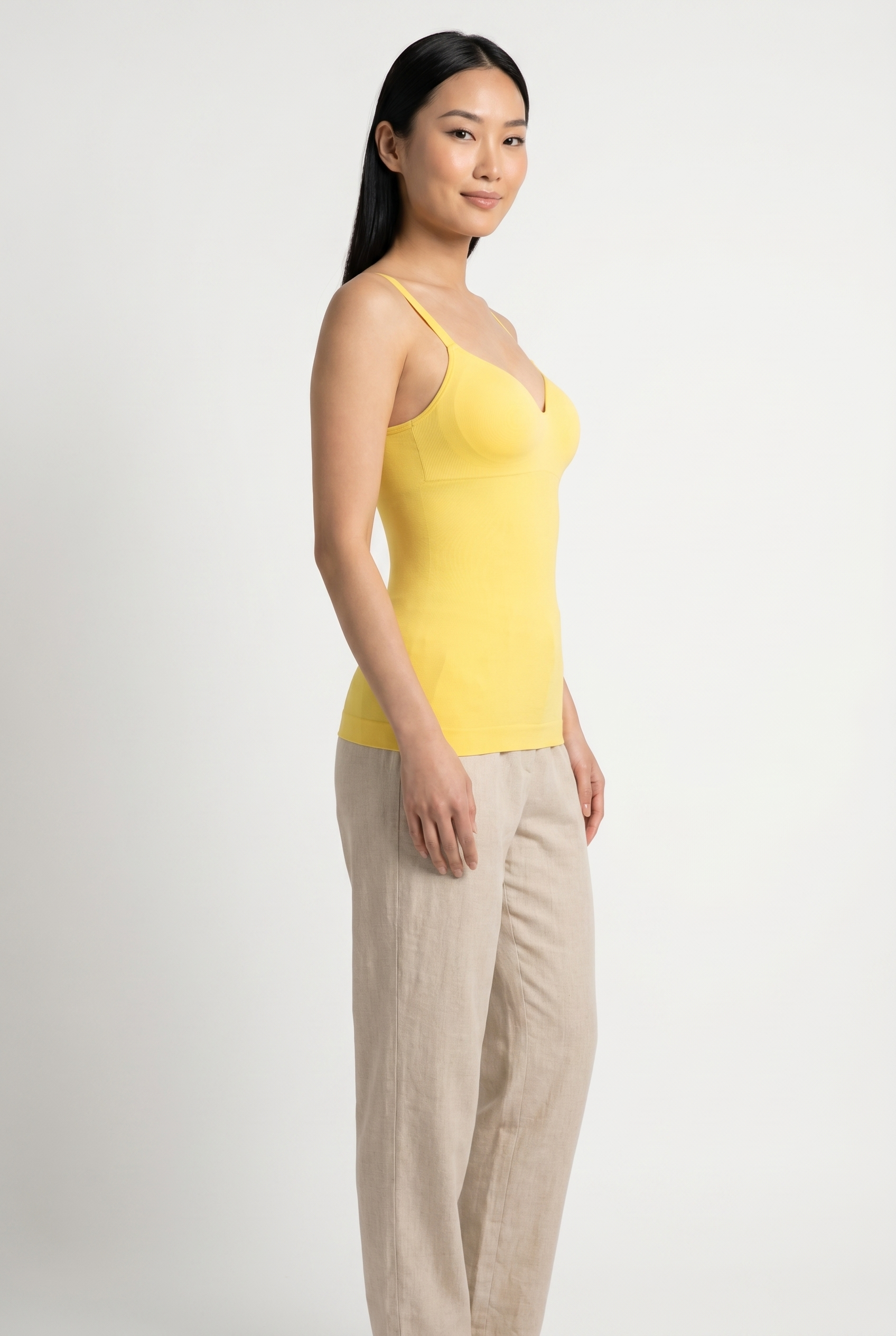 Model wearing cami top, three-quarter angle