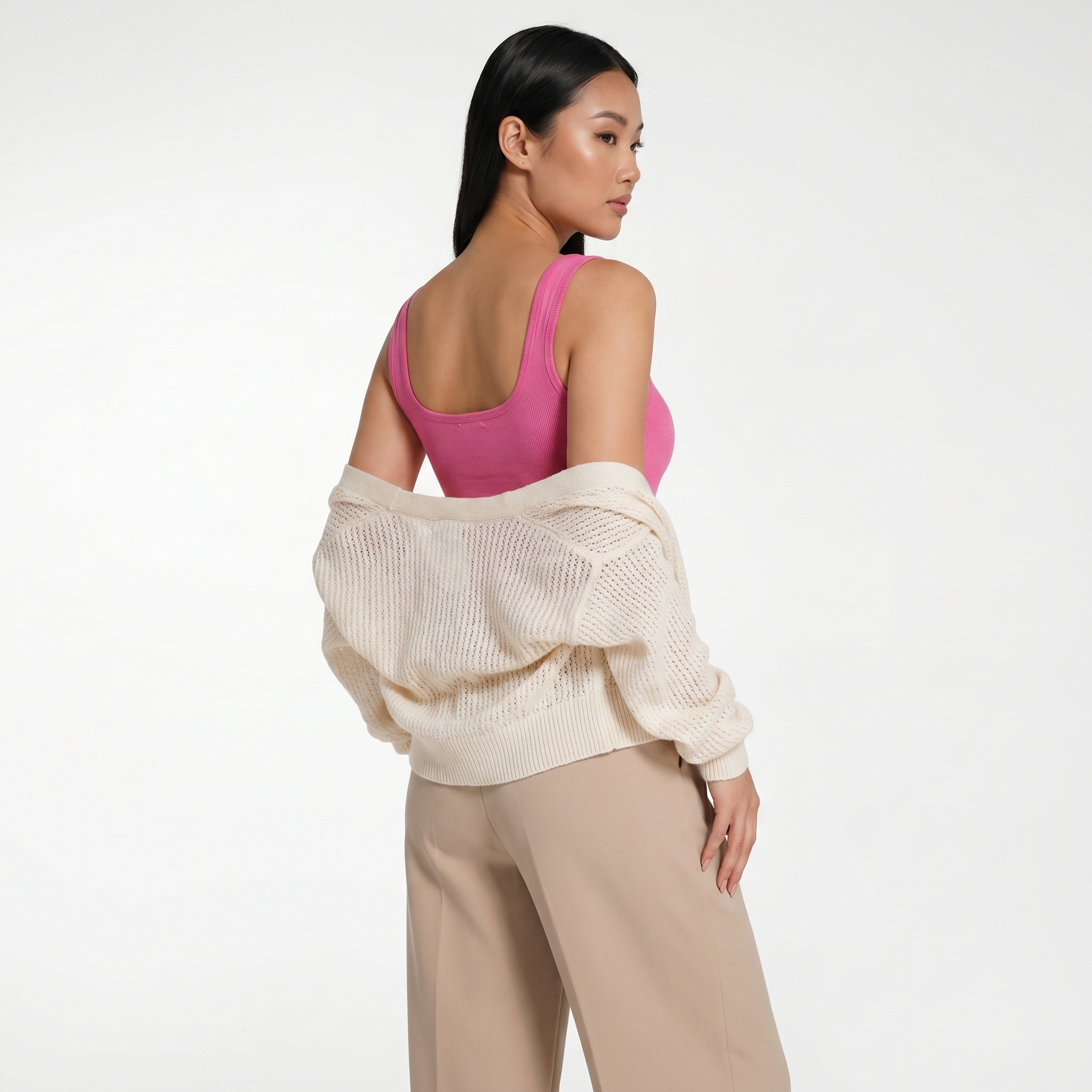 Model wearing modal henley bodysuit with cardigan, back angle