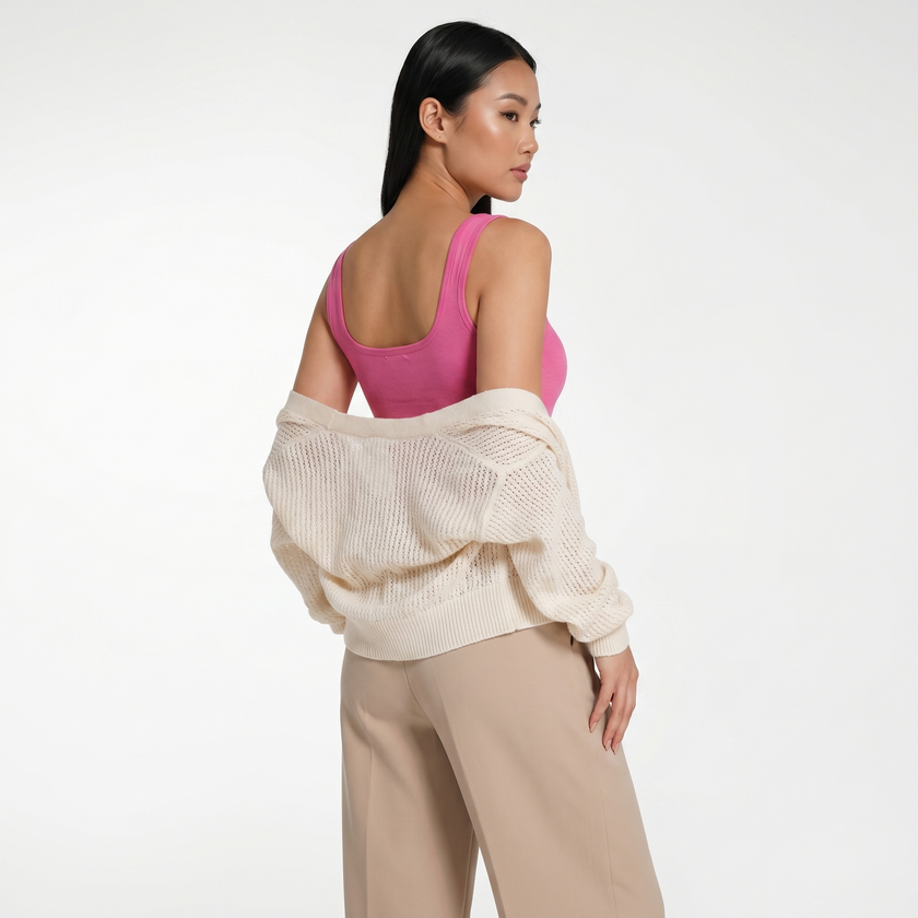 Model wearing modal henley bodysuit with cardigan, back angle